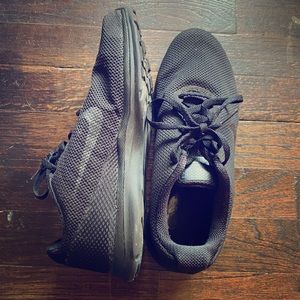 Black on black mesh Nike trainers